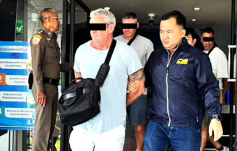 13 Western online bond fraud salesmen appear in court after raid on palatial mansion in Samut Prakan