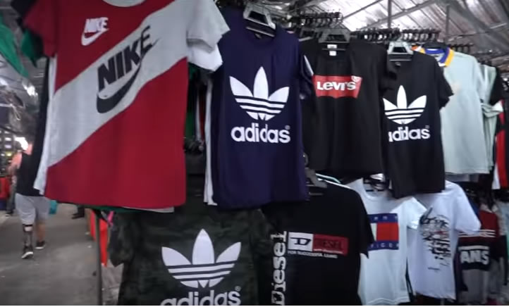 Fake sports shirts on sale in Thailand. A bargain for Thais and part of the Thai economy