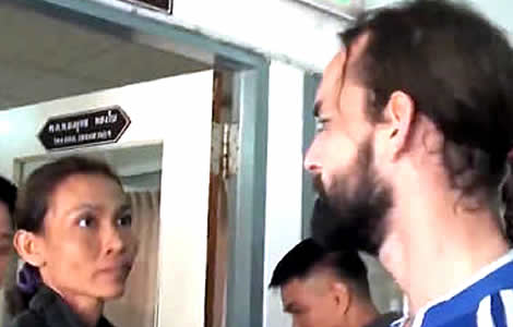 Thai woman and French man say Goodbye leaving for a Thai prison after being convicted of murder