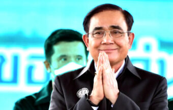 Prayut hails economic progress by his government but his path to reelection next summer is still unclear