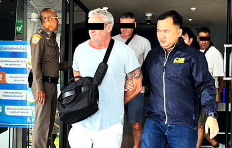 13 Western online bond fraud salesmen appear in court after raid on palatial mansion in Samut Prakan