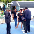 Chinese tourist guide arrested at Bali Hai Pier in Pattaya as he led tourists from a bus in crackdown