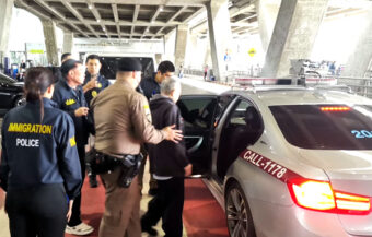 Former Buddhist Office bigwig flown home from the United States after being extradited to face charges