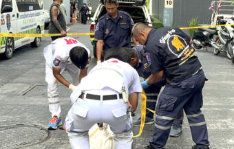 Asian split in two by a 32 story fall from Pattaya building block on Wednesday. Police suspect suicide