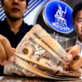 Central Bank moves to restrain runaway baht. Plan to raise the transaction limit from $1 to $10 million for accounts 