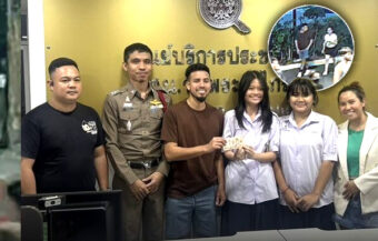 Riverside police officers in Bangkok reunite American man with his lost cash on Tuesday within two hours