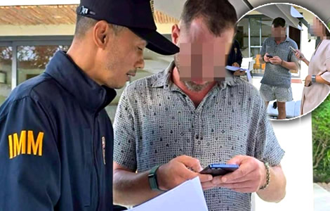 Russian man accused of extortion of a car dealer is arrested by the pool at a luxury resort on Koh Samui