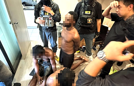 Nest of Nigerian scammers and drug dealers raided in Nonthaburi days after prolific conman was arrested