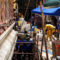 Work on city centre temple halted as red coffin of a female is found buried beneath an image of Buddha