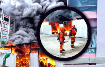 Huge fire in Bangkok brought under control. Garage owner claims a cigarette but from a hotel caused it