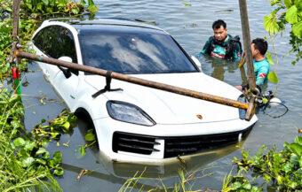 Motorist’s shocked horror after 6 million baht luxury car rolls across a motorway and into a deep irrigation canal