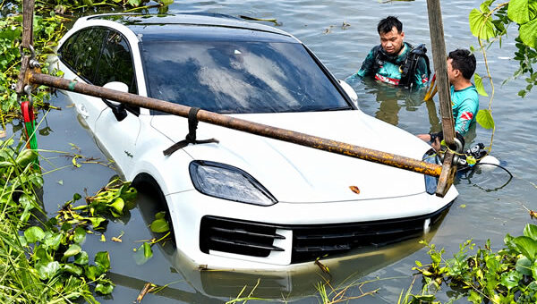 Motorist’s shocked horror after 6 million baht luxury car rolls across a motorway and into a deep canal