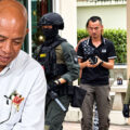 Police officer bursts into tears as he surrenders to police led by son a day after murdering his wife