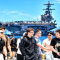 USS George HW Bush arrives in Phuket one day early and berths 3.3km offshore. Sailors landing ashore in holiday mode