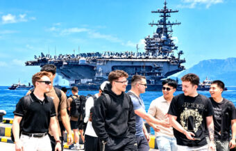USS George HW Bush arrives in Phuket one day early and berths 3.3km offshore. Sailors landing ashore in holiday mode
