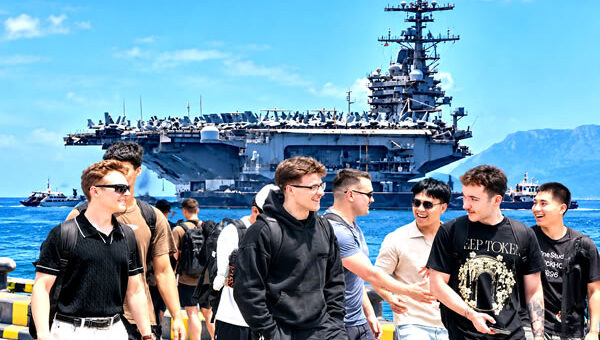USS George HW Bush arrives in Phuket one day early and berths 3.3km offshore. Sailors landing ashore
